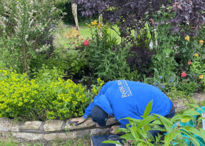 Stu laying a brick wall at Glastonbury peace gardens